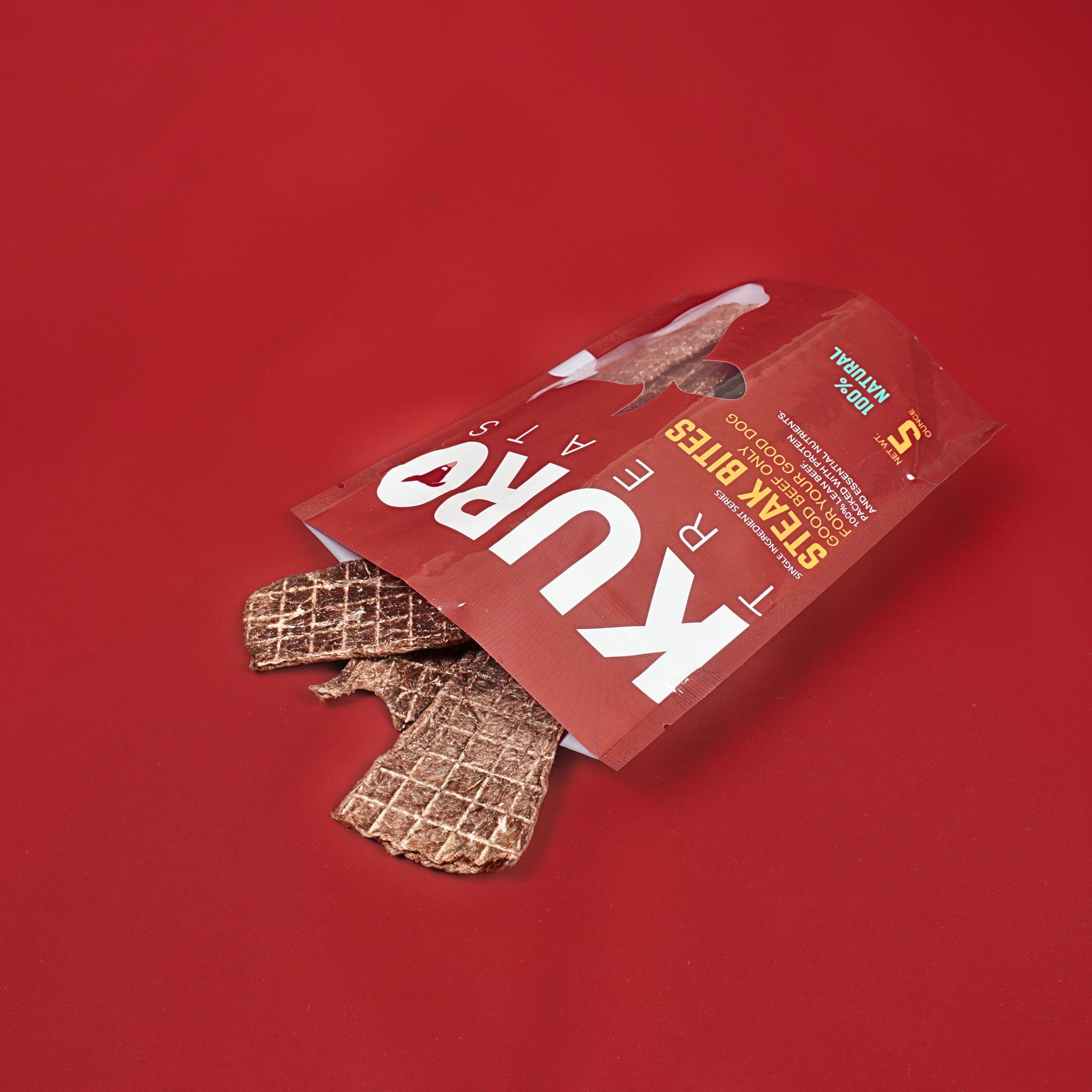 opened bag of steak bite treats for dogs